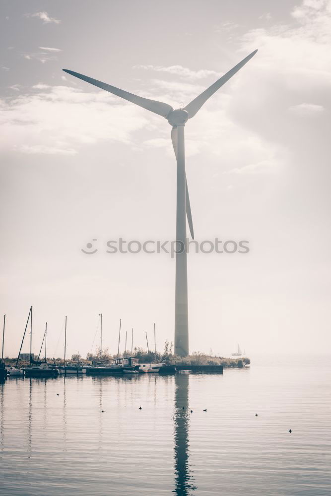 Similar – Image, Stock Photo Wind power plants in the morning haze