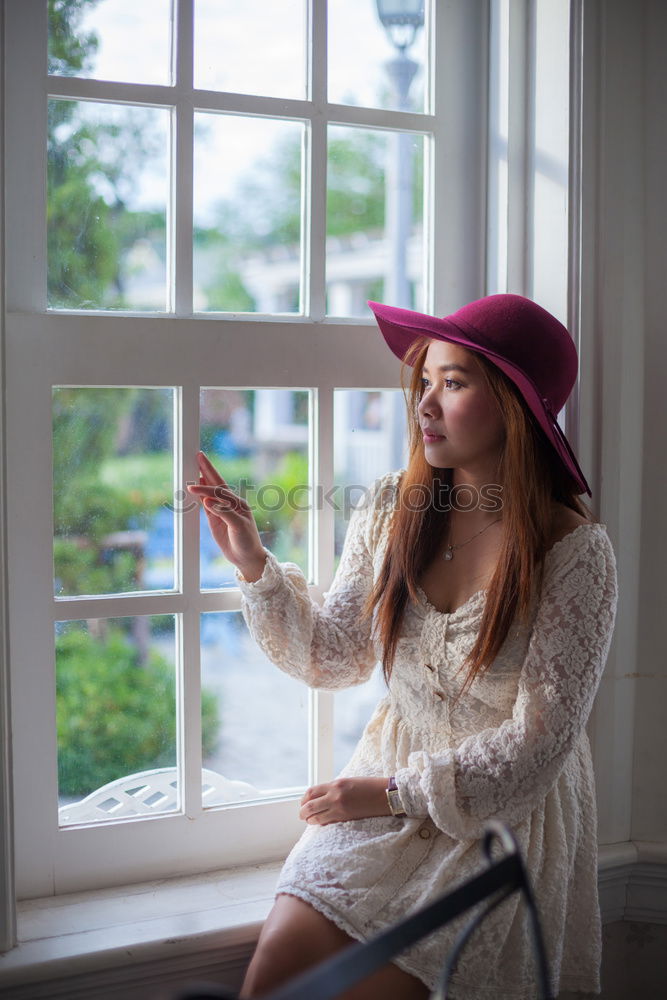 Similar – young redhead woman with curls on her balcony