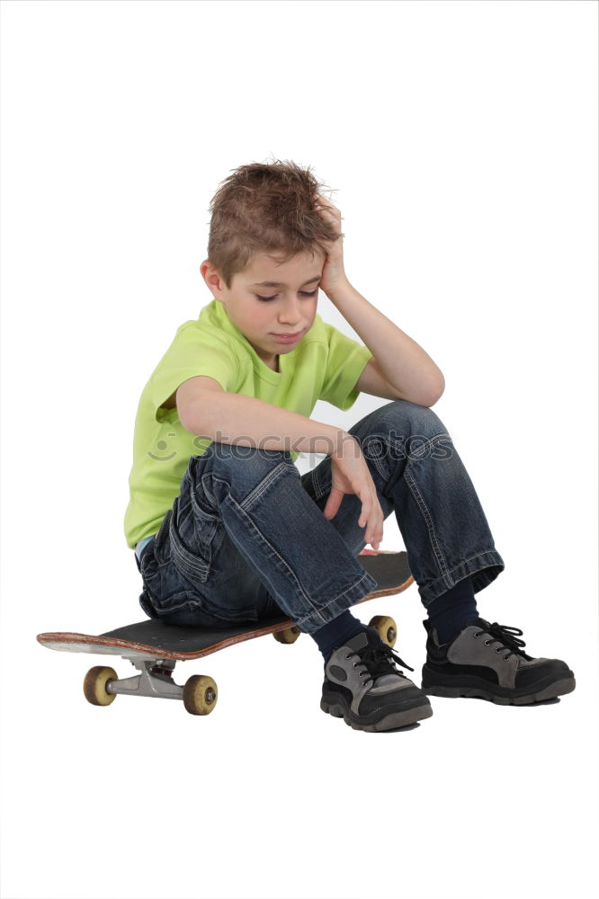 Similar – Image, Stock Photo A smiling boy with skateboard sitting alone on the floor