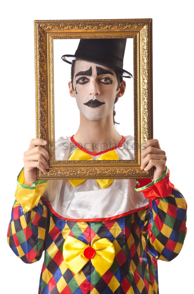 Similar – Young man with a clown costume is holding a little bike