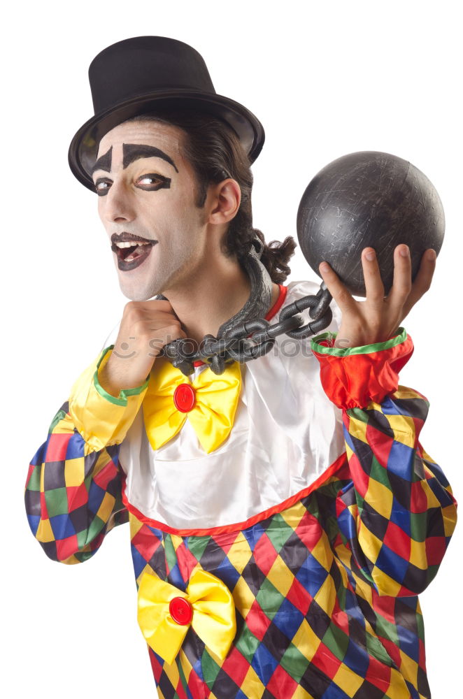 Similar – Young man with a clown costume is holding a little bike