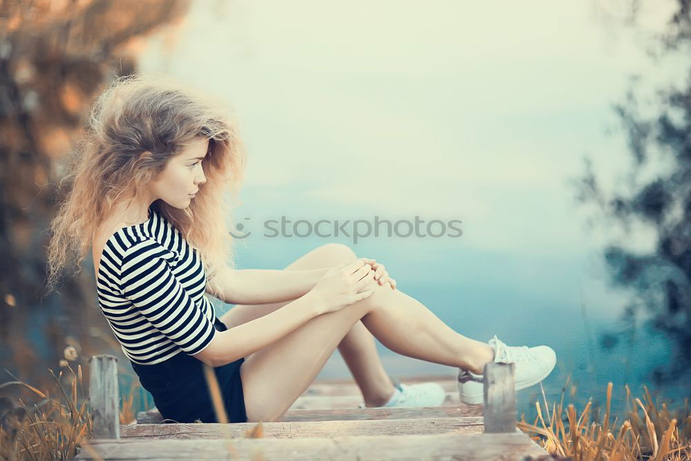 Similar – Image, Stock Photo Happy woman sitting on urban background sunbathing