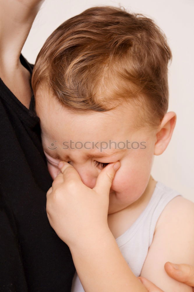 sad son hugging his mother at home. Concept of couple family is in sorrow.