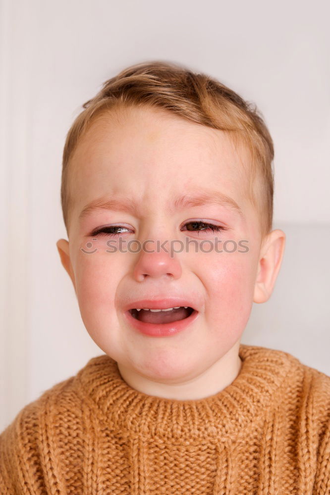 Similar – Image, Stock Photo baby sitting sad and crying in the room