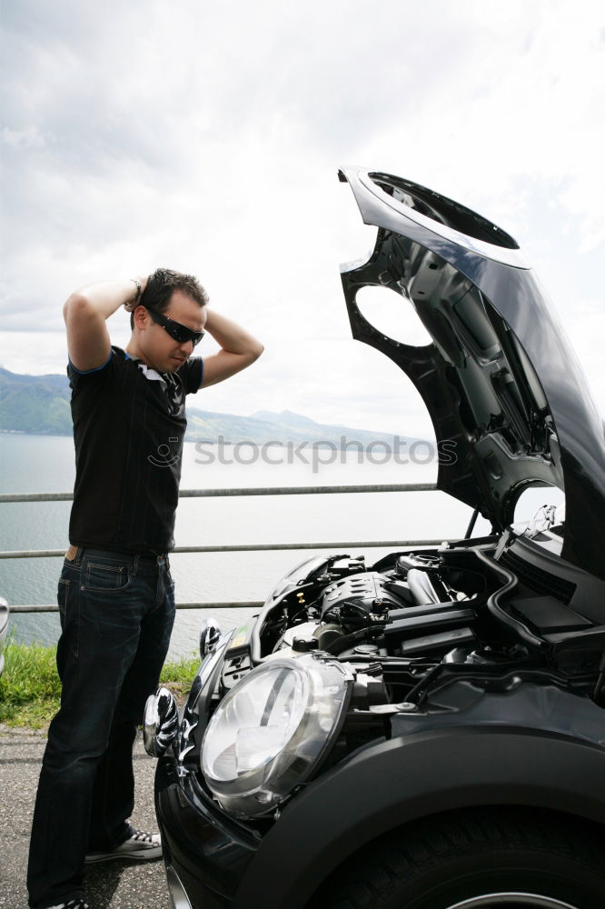 Similar – young guy repairing an old car