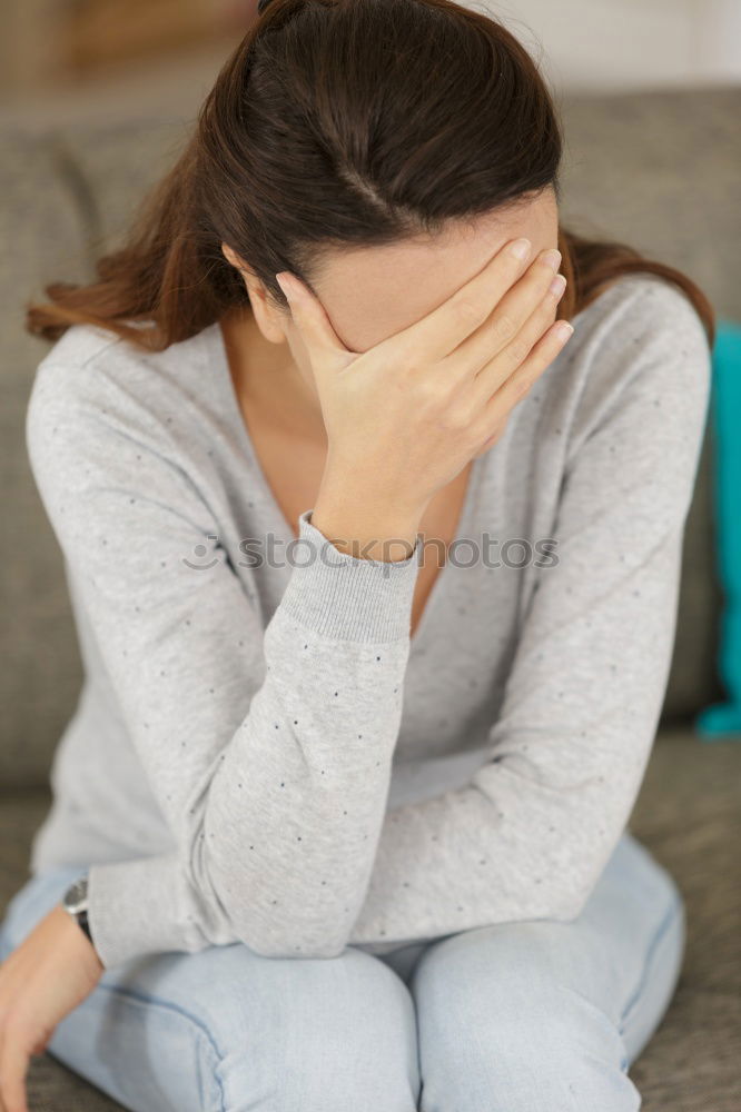 Similar – sad little girl sitting near the wall