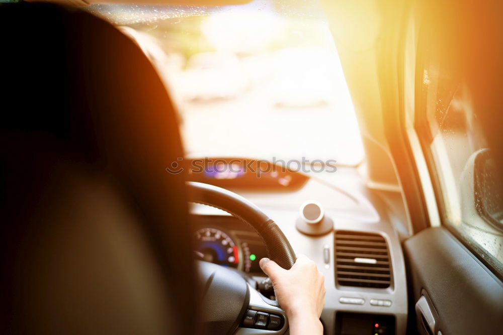 Similar – father teaching kid daughter to drive a car