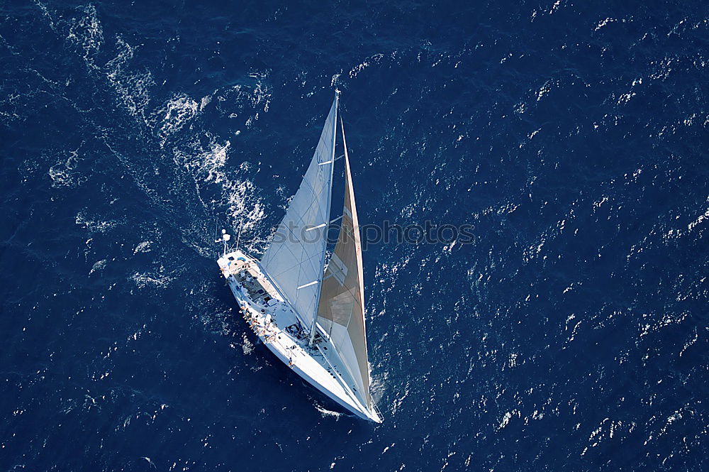 Sailing boat on blue Lake Garda II