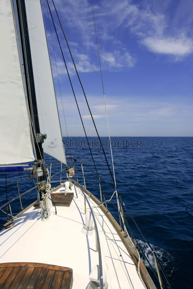 Similar – Sailing in a sailing boat with wooden superstructure with waves hard on the wind the sea foams