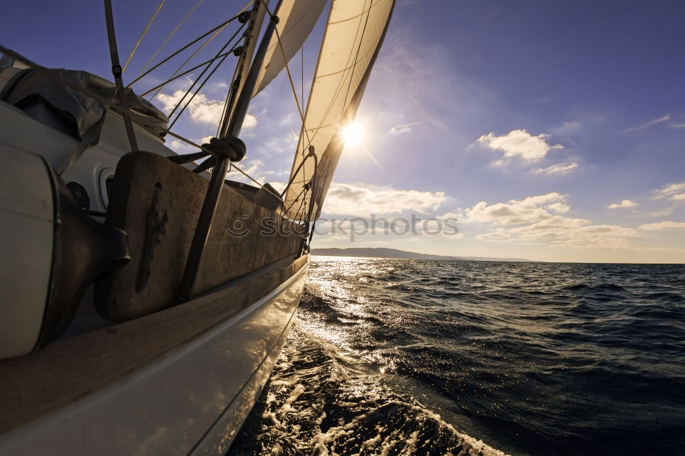 Similar – Sailing in a sailing boat with wooden superstructure with waves hard on the wind the sea foams