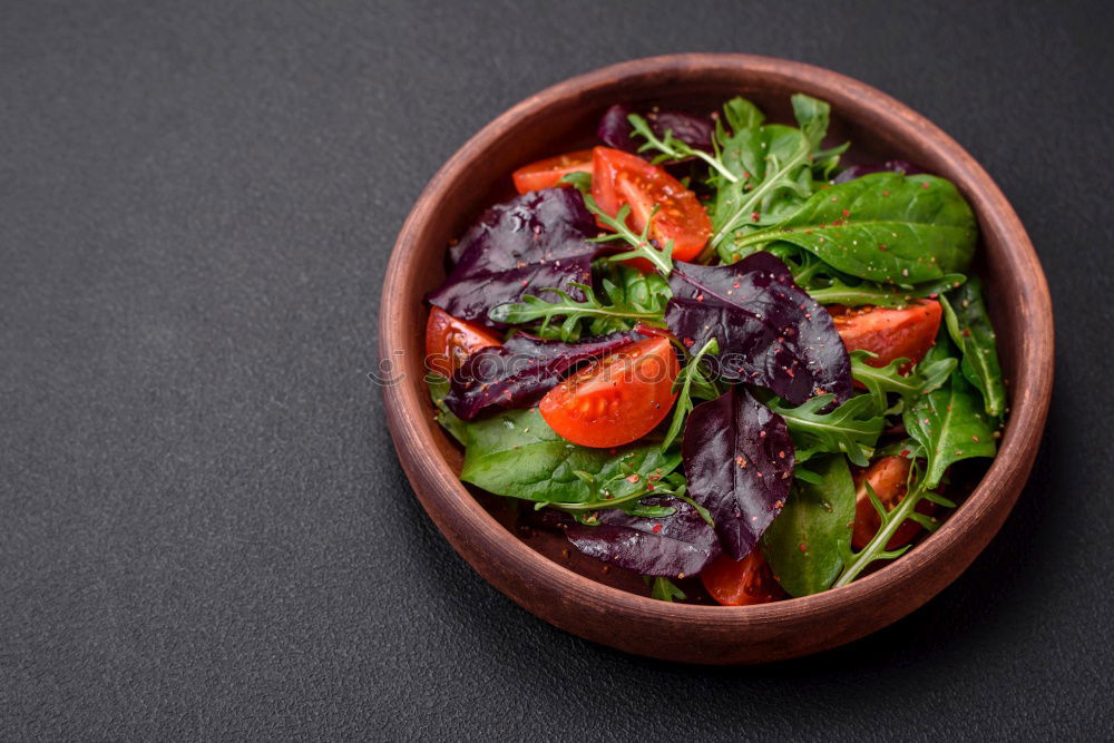 Similar – fresh salad on dark wooden table