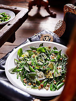 Similar – Healthy green salad with dressing on dark background