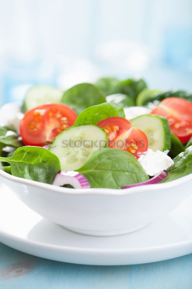 Vegan tofu salad with tomatoes and lamb’s lettuce