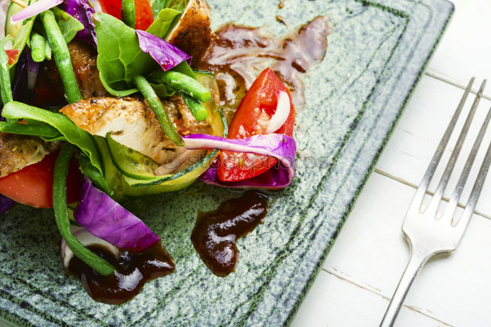 Similar – fresh salad on dark wooden table