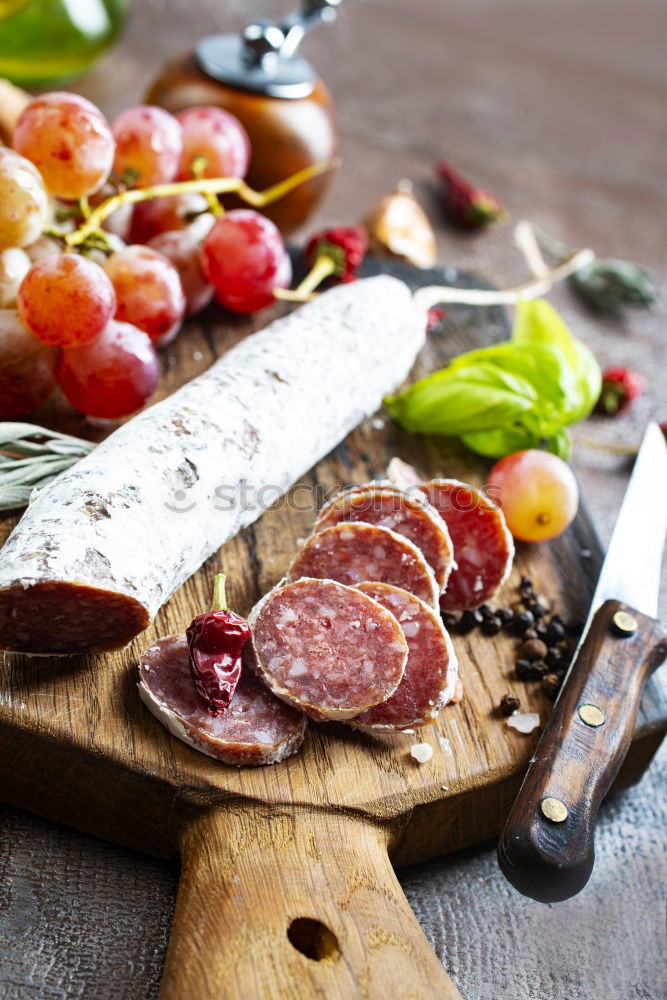 Similar – Spanish serrano ham, cheese and sausage