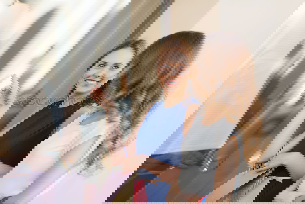 Similar – Image, Stock Photo Two young women going through clothes from their wardrobe at home