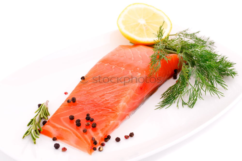 Similar – Raw salmon fillet with green herbs and lemon