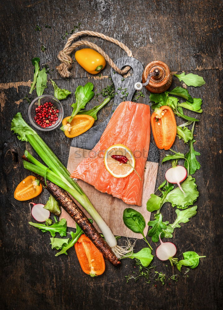 Similar – salmon, fresh herbs, oil and spoon on old wooden table