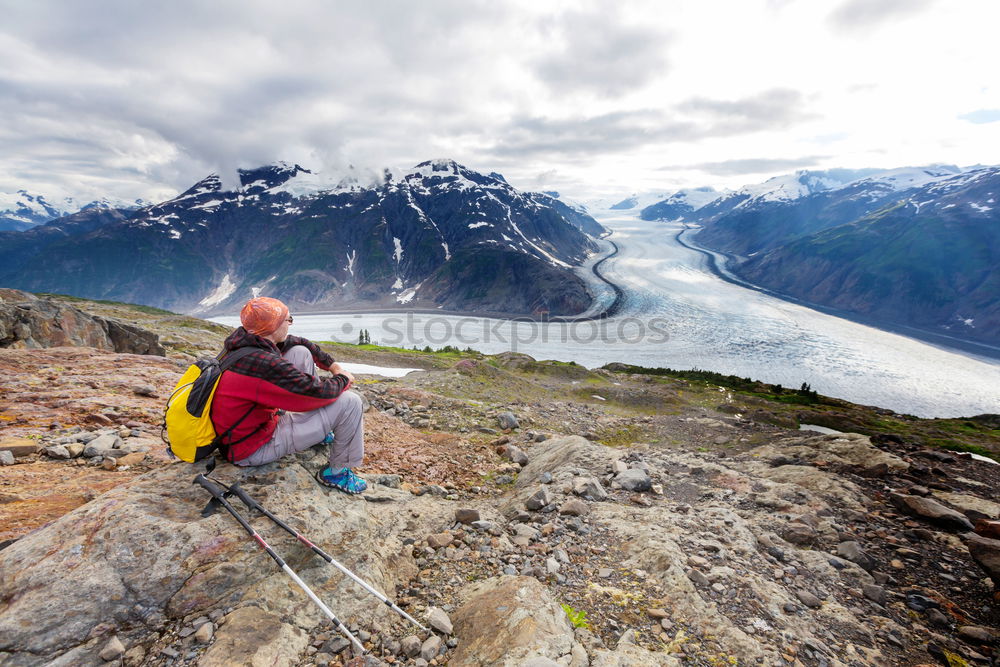 Similar – Image, Stock Photo Two hiking backpacks in front of an evening mountain panorama