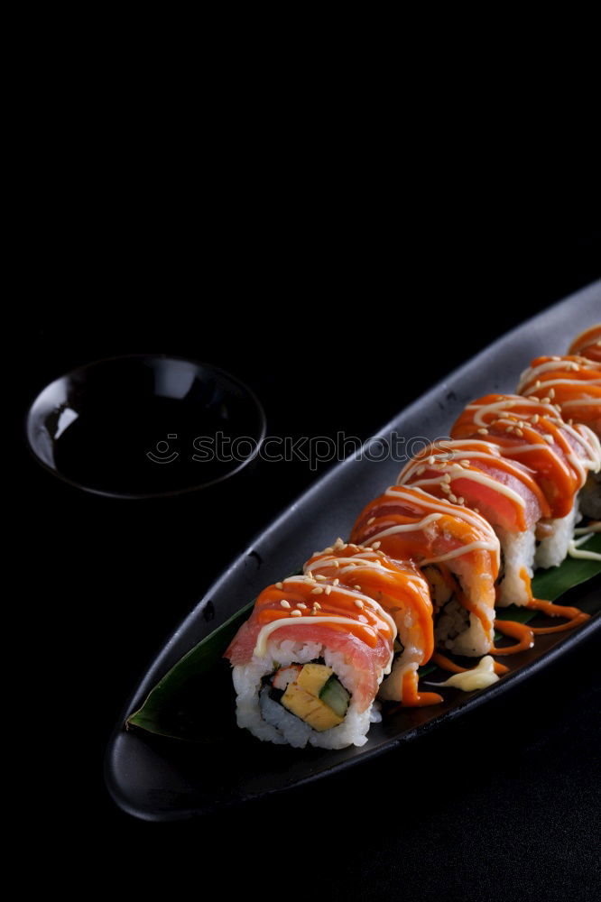 Similar – Japanese food: maki and nigiri sushi set on black background.