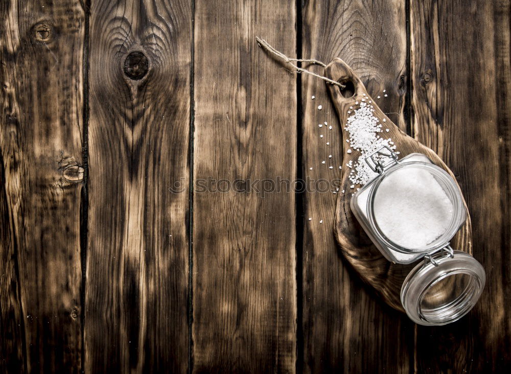 Black cast-iron frying pan on a brown wooden surface