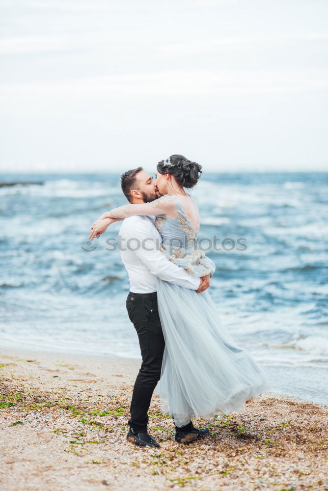 Similar – Image, Stock Photo Tender kissing bridal couple in sunlight