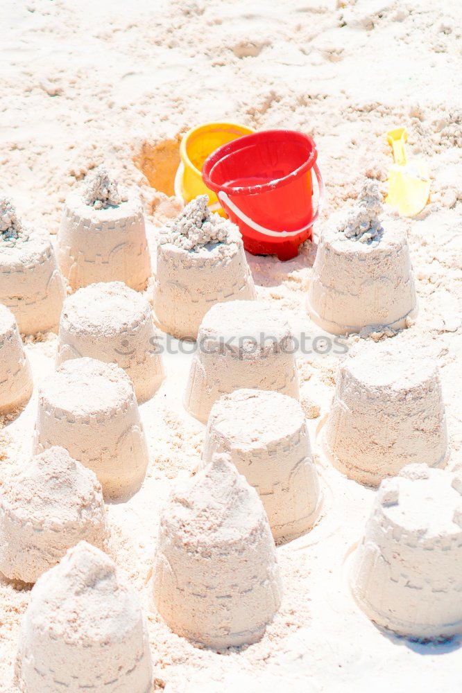 Similar – Image, Stock Photo Small child plays with bucket on the beach