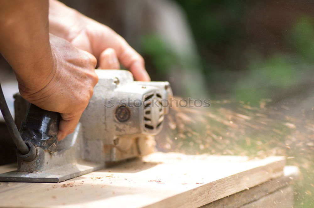 Similar – Image, Stock Photo Man drilling hole in timber while working in garden