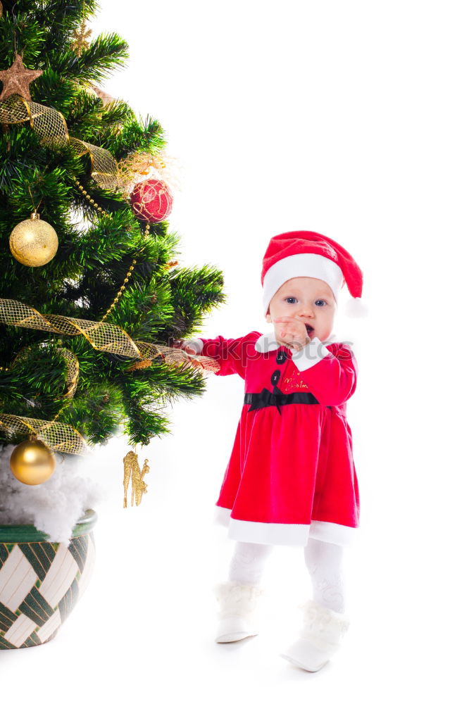 Similar – Image, Stock Photo Young girl decorating Christmas tree with lights at home