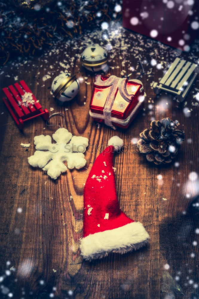 Image, Stock Photo Santa hat and decoration on a dark wooden table