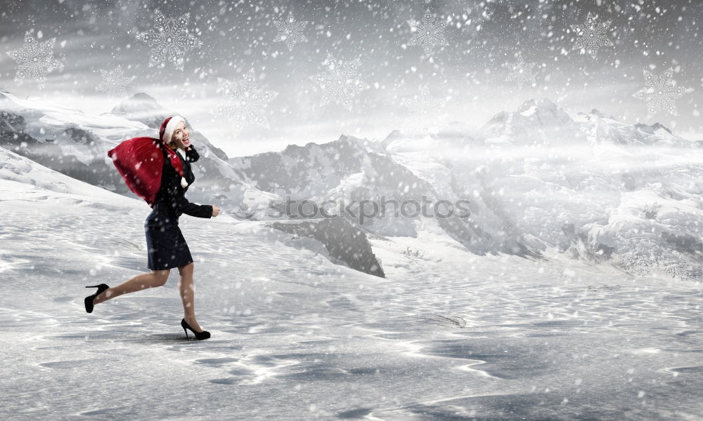 Similar – Skier in snowy landscape with hiking backpack