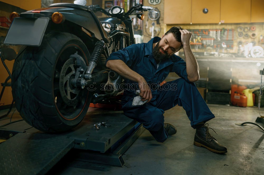 Similar – Image, Stock Photo Mechanic checking motorcycle