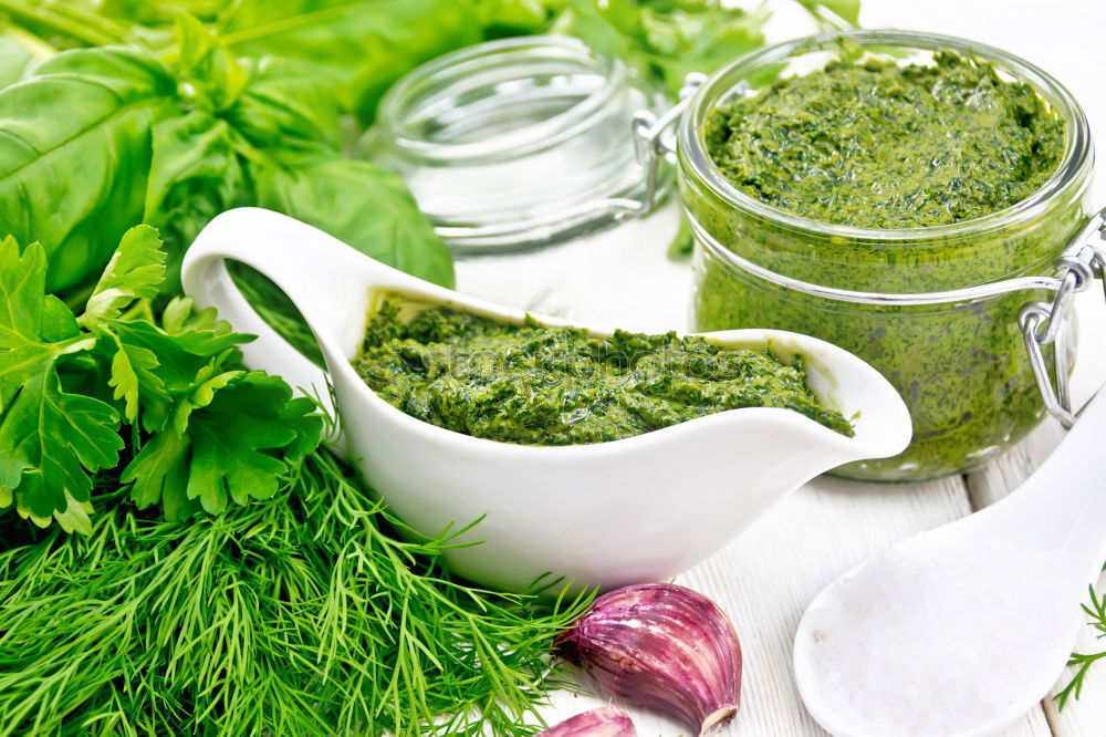 Similar – Green kale pesto in glass on dark rustic kitchen table background with ingredients, top view. Kale preparation. Healthy detox vegetables . Clean eating and dieting concept.