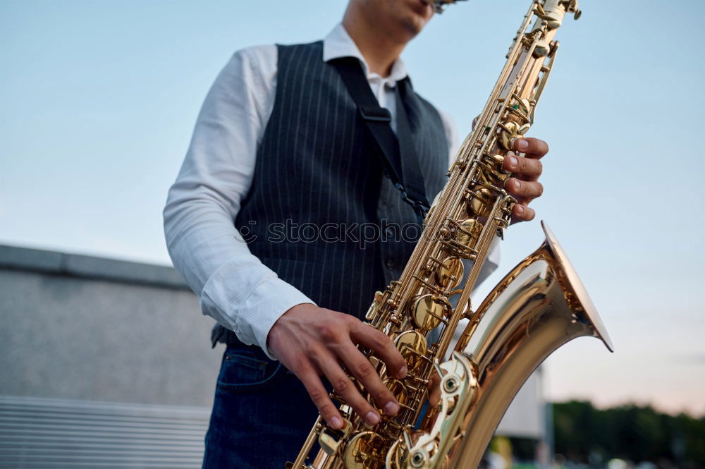 Similar – Smiling jazzman with sax