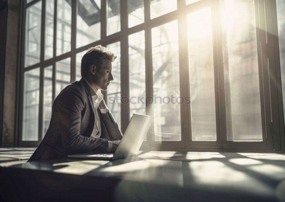 Similar – Young man writing in notebook