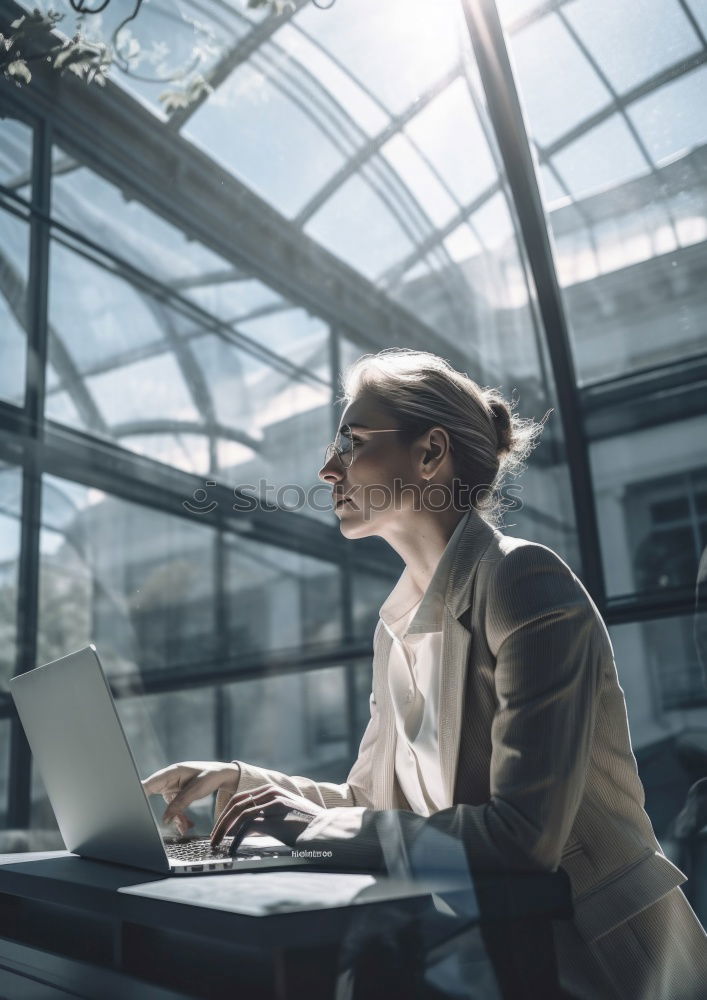 Similar – Woman in armchair using laptop and drinking coffee