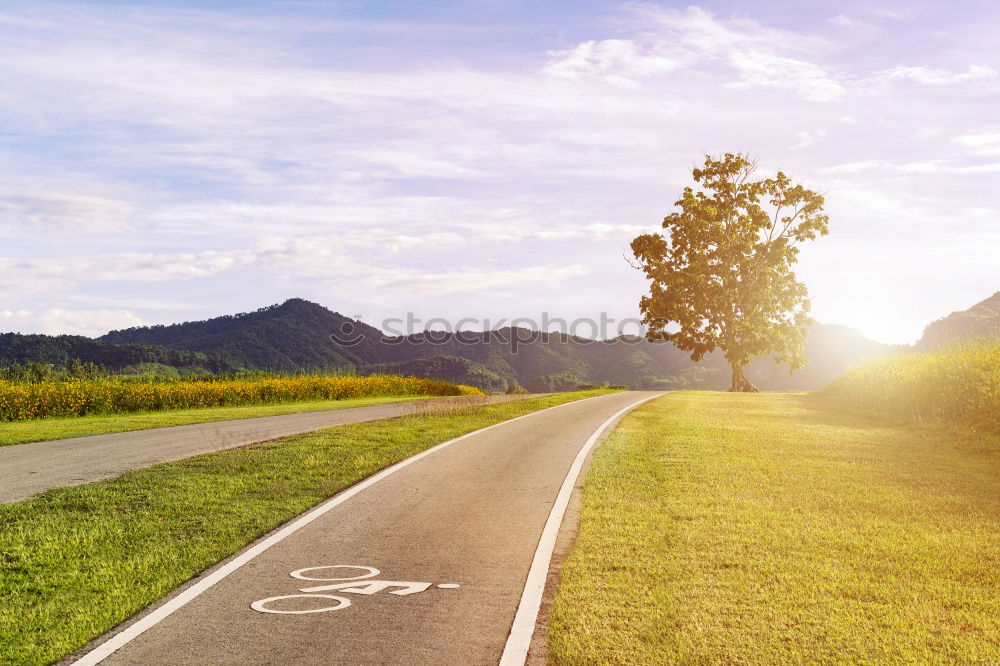 Similar – man with an e-bike looks at a road map