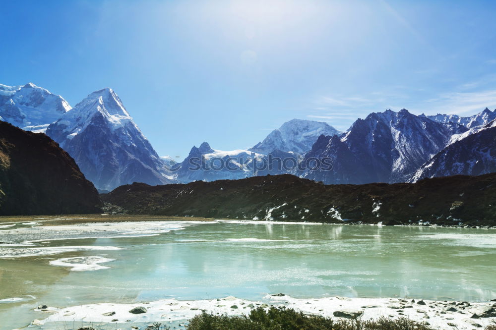 Similar – Image, Stock Photo Mountain landscape with a lot of kite surfers and windsurfers moving in a lake. They use the wind to move their boards on the water. Mountains are as background in a sunny day.