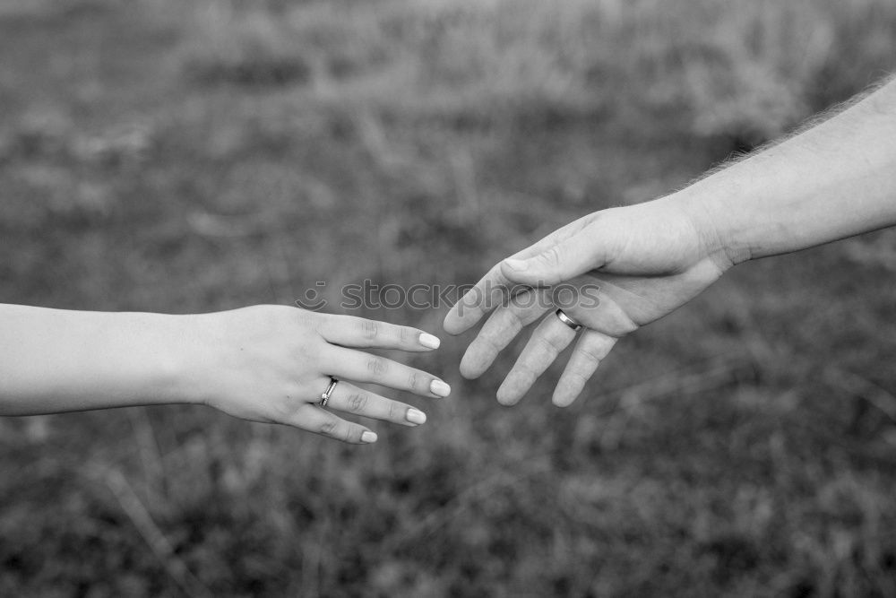 Similar – Mothers hands holding premature babies feet