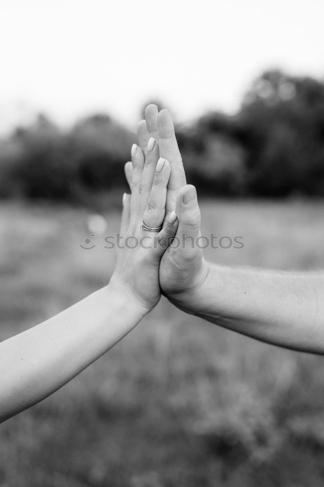 Similar – Mothers hands holding premature babies feet