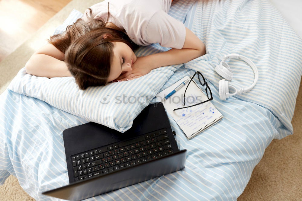 Similar – Image, Stock Photo Young girl looking at mobile phone while sitting on bed