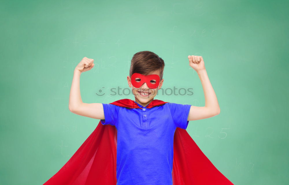 Similar – Happy little child playing superhero. Kid having fun outdoors. Concept of girl power.