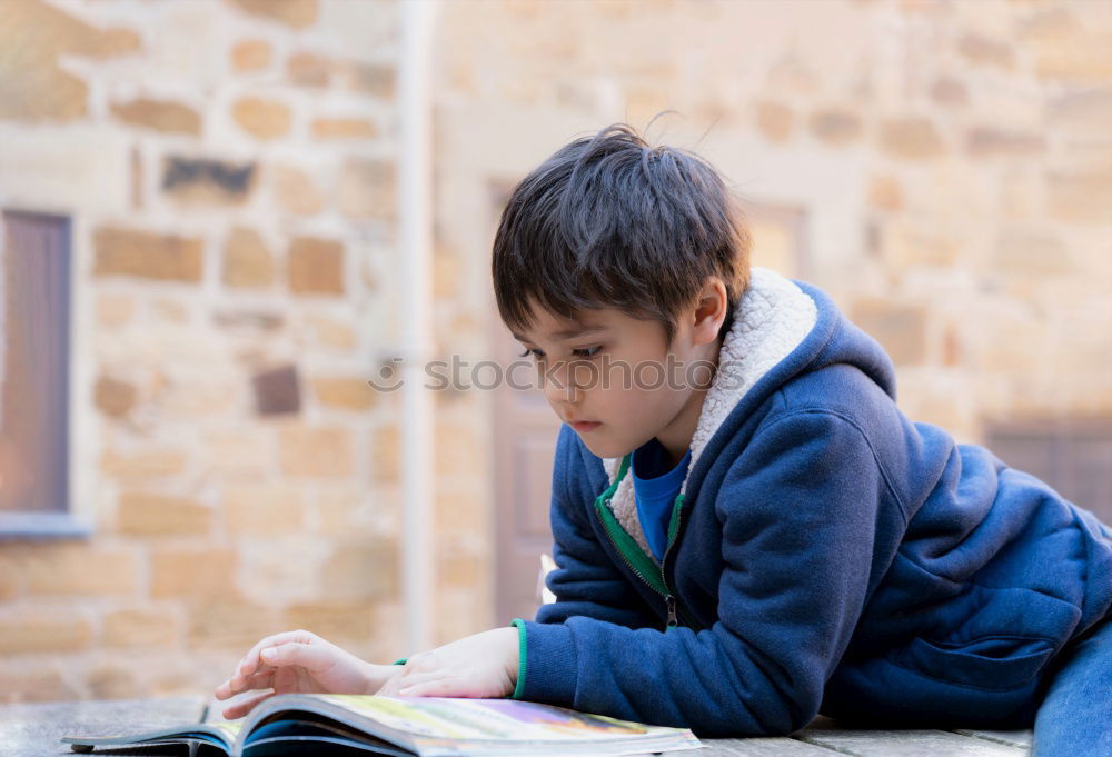 Similar – Image, Stock Photo young boy looking at tablet pc computer with frustrated look on his face