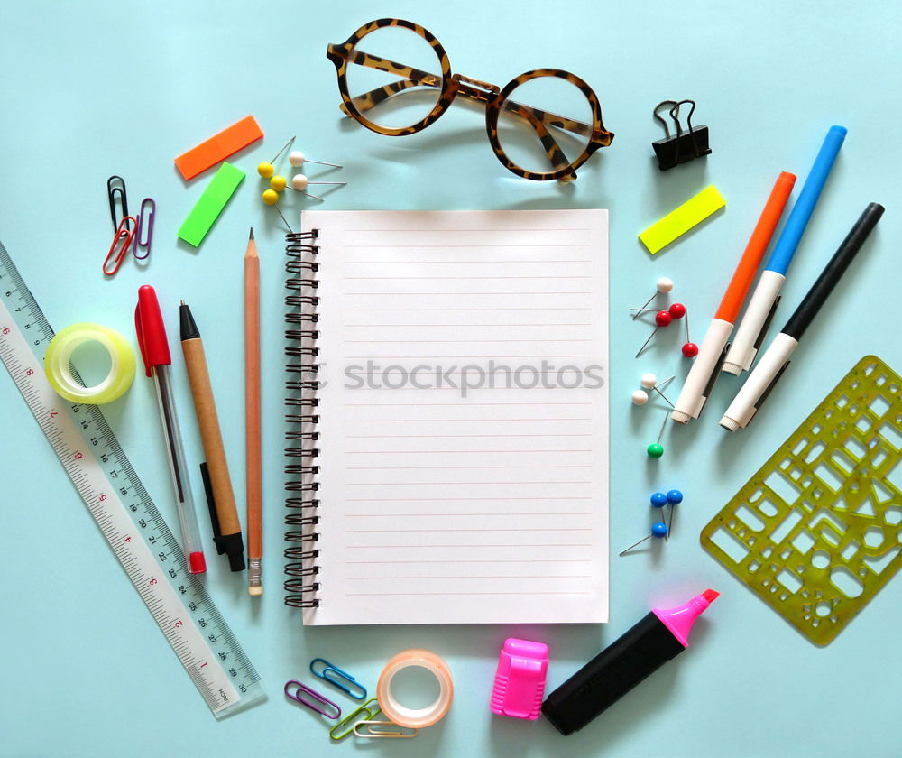 Similar – workplace with notepad, glasses, watch, pen