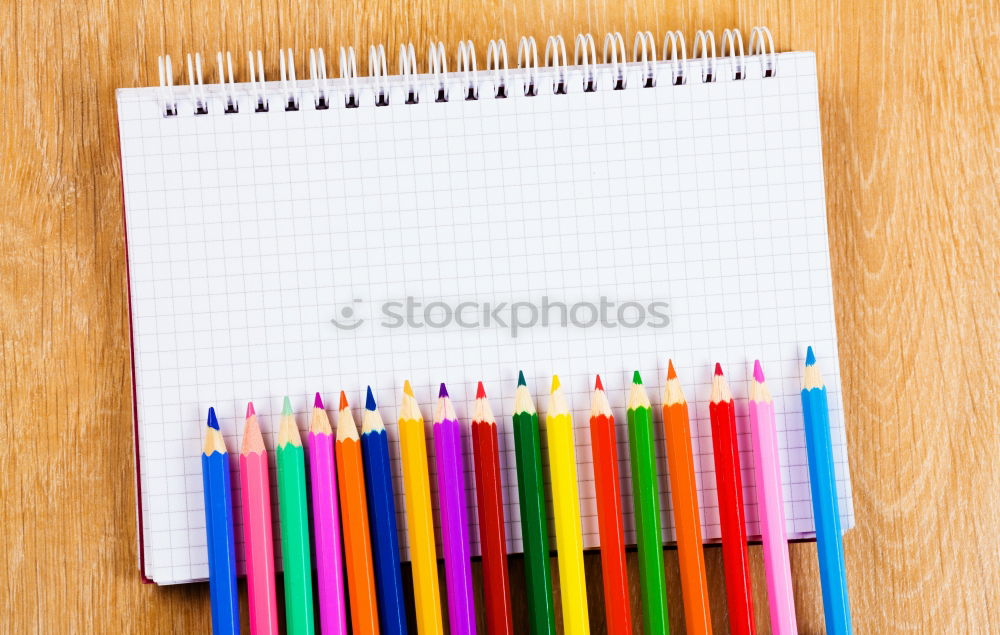 Similar – Notepads, papers, markers and other stationery on wooden table