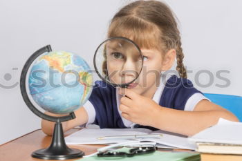 Similar – Image, Stock Photo Schoolgirl covering face with globe