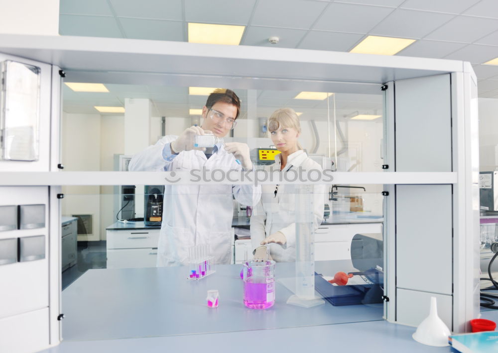 Similar – Worker putting liquid to test tube