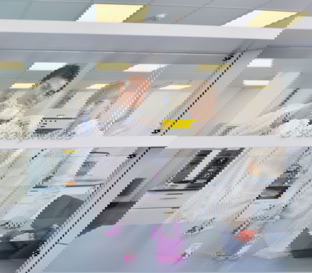 Similar – Image, Stock Photo Women standing and working in lab