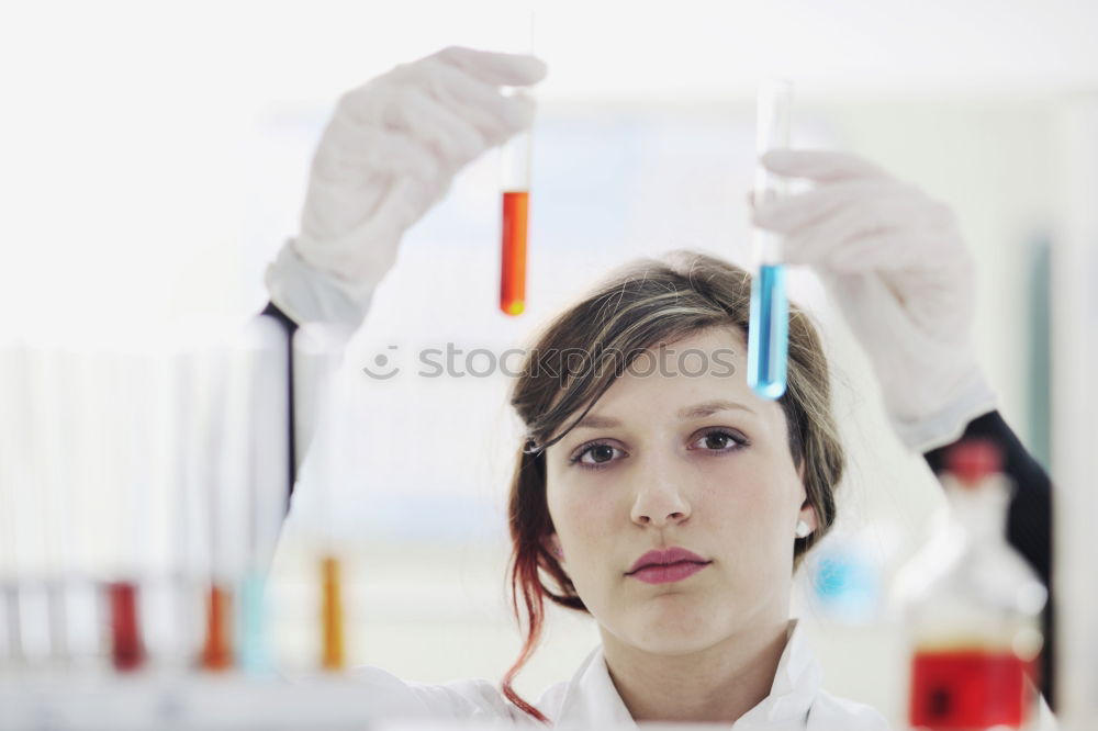 Similar – Image, Stock Photo Woman looking at test tube