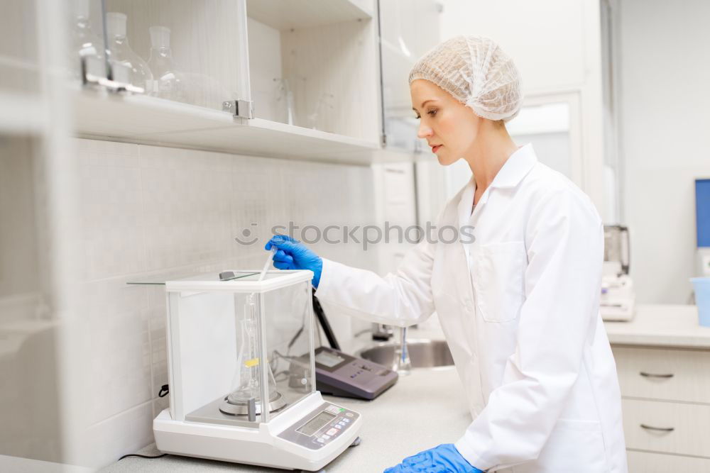 Similar – Image, Stock Photo Worker putting liquid to test tube